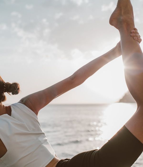 Woman in a calm yoga pose, embodying balance and serenity.